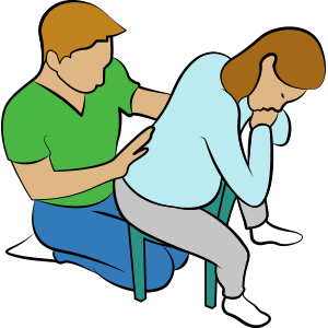 Pregnancy relaxation exercise: Leaning forward on cushions using a chair.