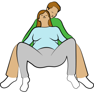 Pregnancy relaxation exercise: Semi-sitting, leaning her back on her partner.