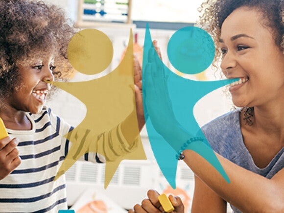 A mother and her child playing with toys together.