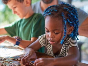 A girl puts together puzzles img A girl puts together puzzles img