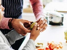 Nido Recipe: Ensure Your Kids Health With Healthy Meals An adult helping a child to prepare fruit and vegatables
