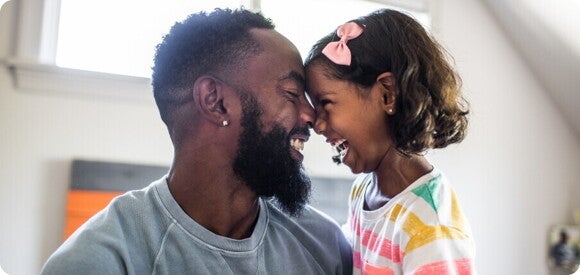 Father and daughter look at each other Father and daughter look at each other